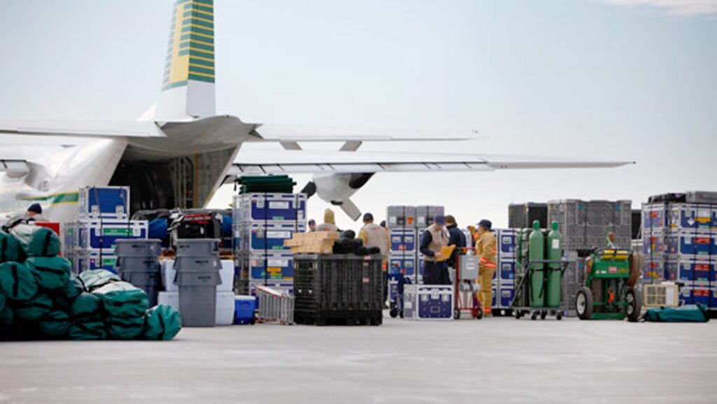Workers loading air cargo onto an aircraft at Jeddah Airport.